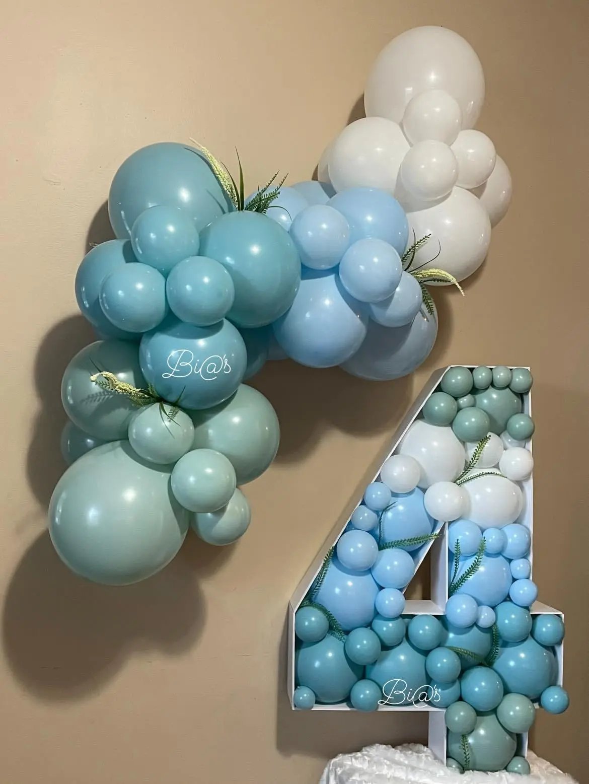 Blue and sage balloon garland built for a Lincoln birthday
